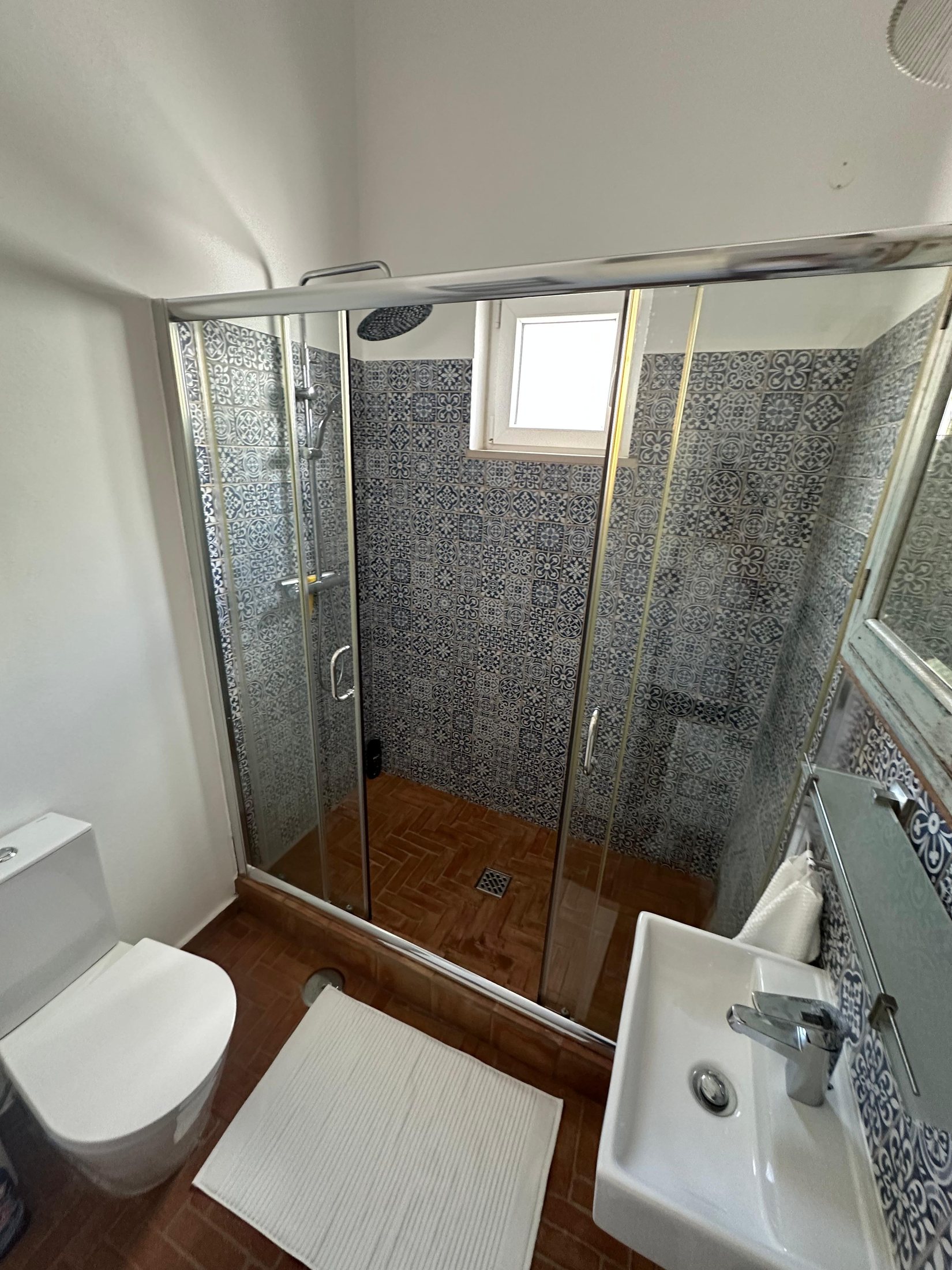 First bathroom with patterned Portuguese tiles